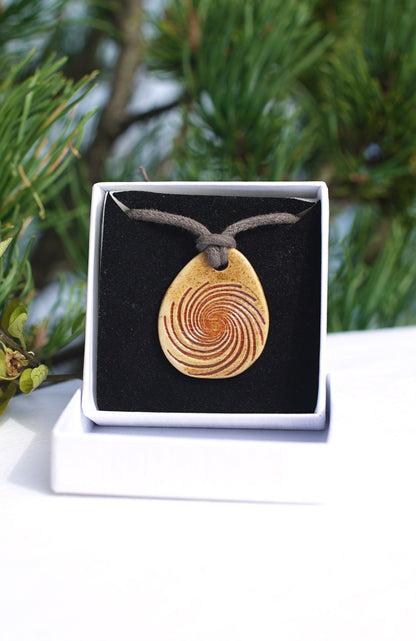 Amulet spiral red with Agnihotra ash