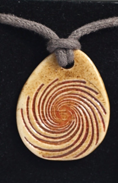 Amulet spiral red with Agnihotra ash
