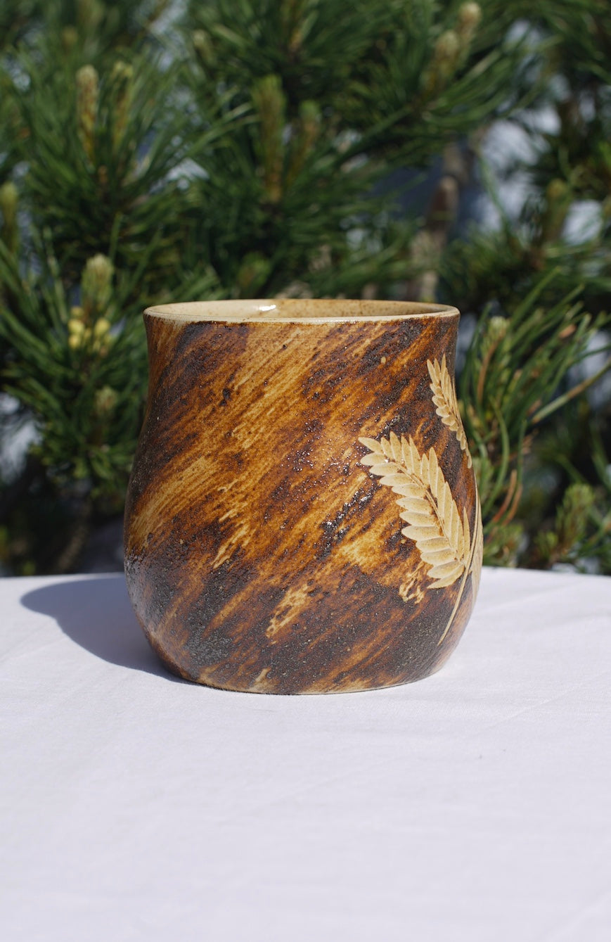 Cup of fern with healing clay