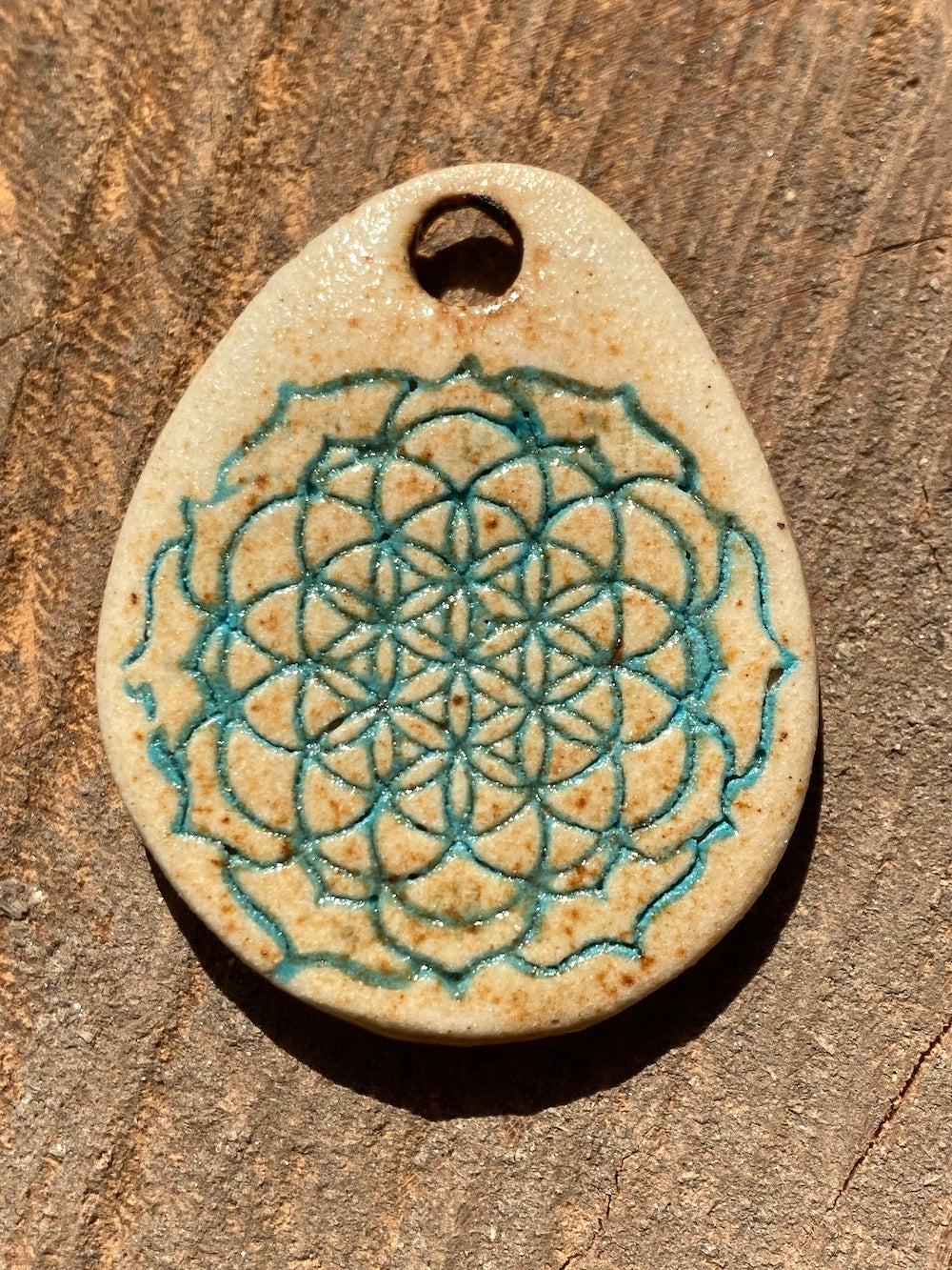 Amulet with flower of life in jade
